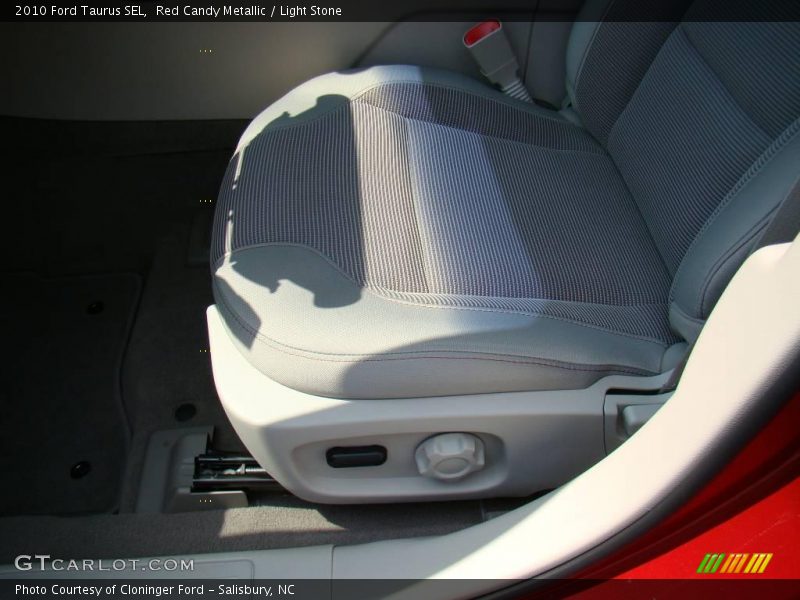Red Candy Metallic / Light Stone 2010 Ford Taurus SEL