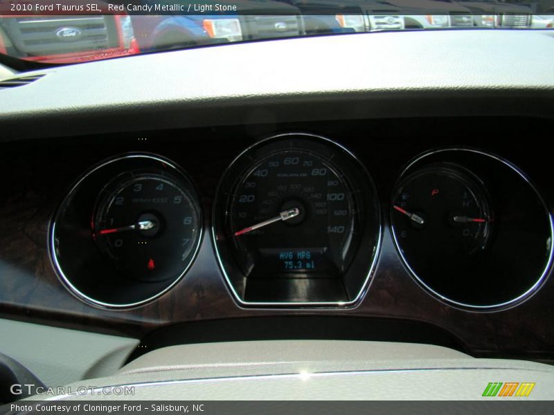 Red Candy Metallic / Light Stone 2010 Ford Taurus SEL
