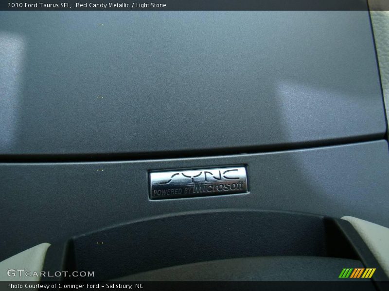 Red Candy Metallic / Light Stone 2010 Ford Taurus SEL