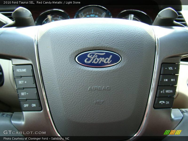Red Candy Metallic / Light Stone 2010 Ford Taurus SEL