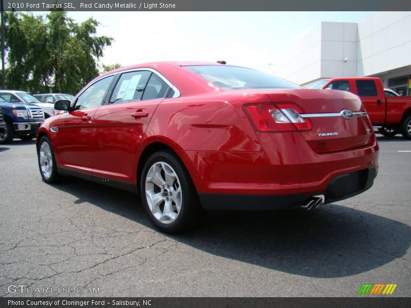 Red Candy Metallic / Light Stone 2010 Ford Taurus SEL