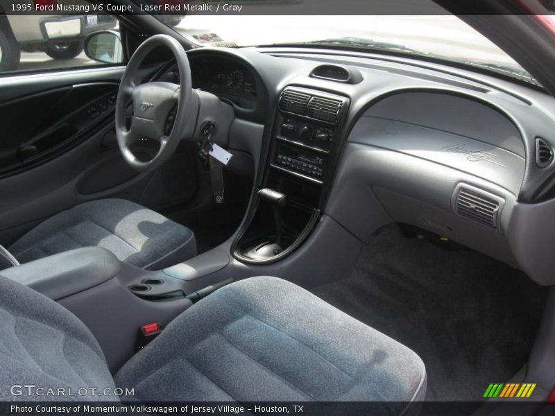 Laser Red Metallic / Gray 1995 Ford Mustang V6 Coupe