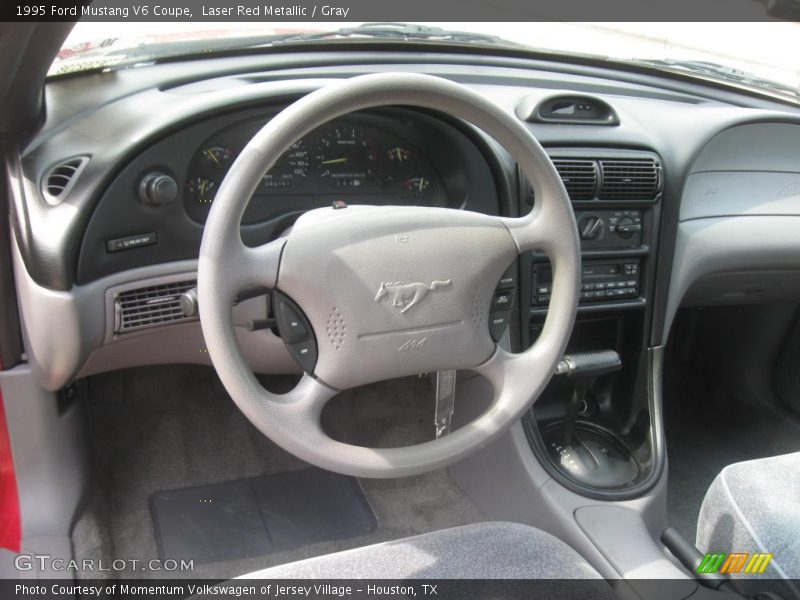Laser Red Metallic / Gray 1995 Ford Mustang V6 Coupe