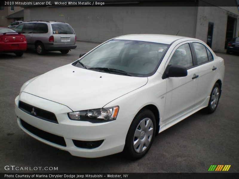 Wicked White Metallic / Beige 2010 Mitsubishi Lancer DE