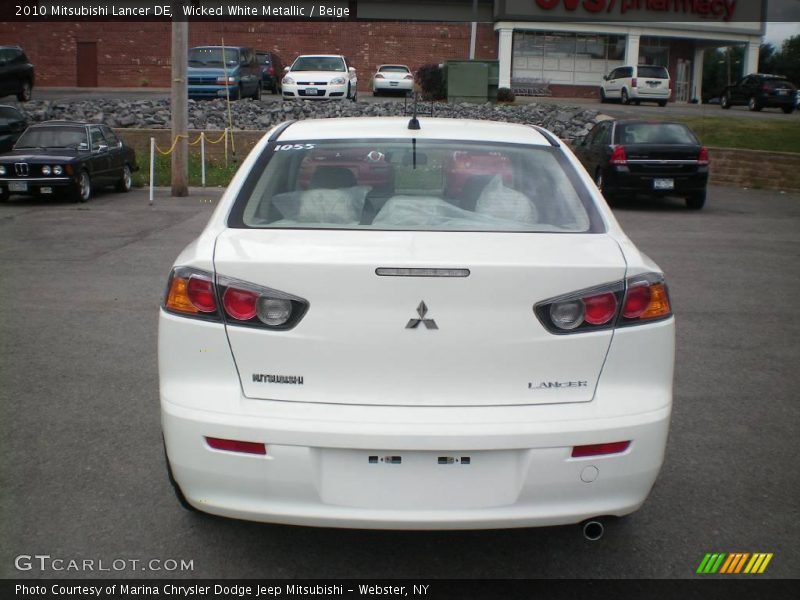 Wicked White Metallic / Beige 2010 Mitsubishi Lancer DE