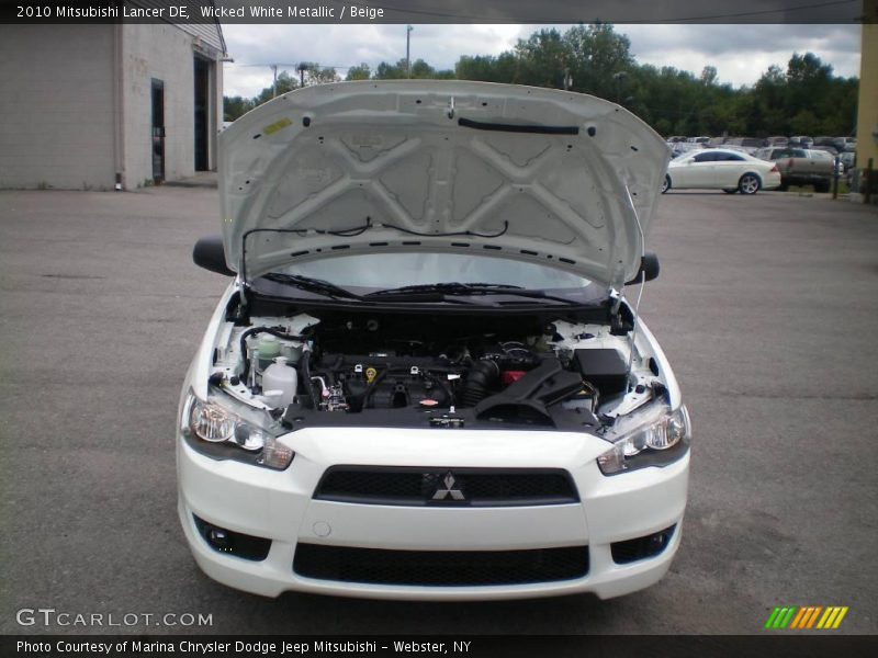 Wicked White Metallic / Beige 2010 Mitsubishi Lancer DE