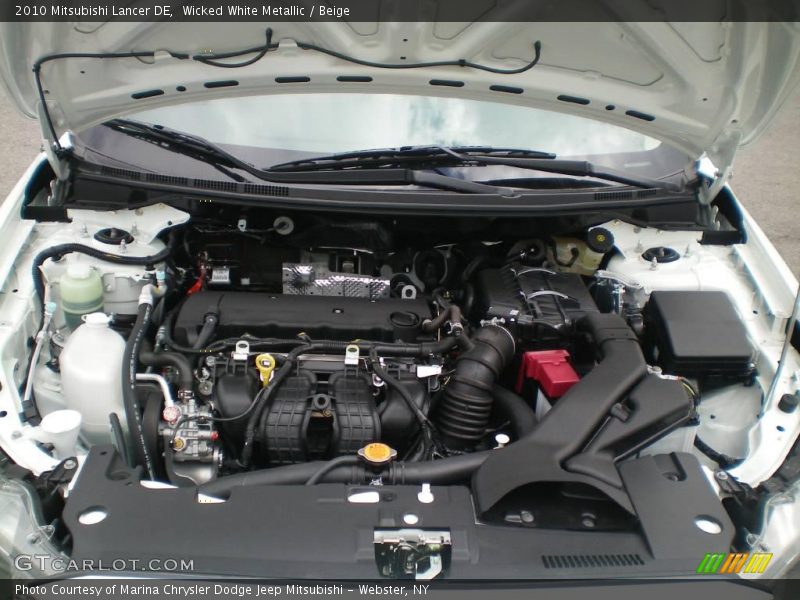 Wicked White Metallic / Beige 2010 Mitsubishi Lancer DE