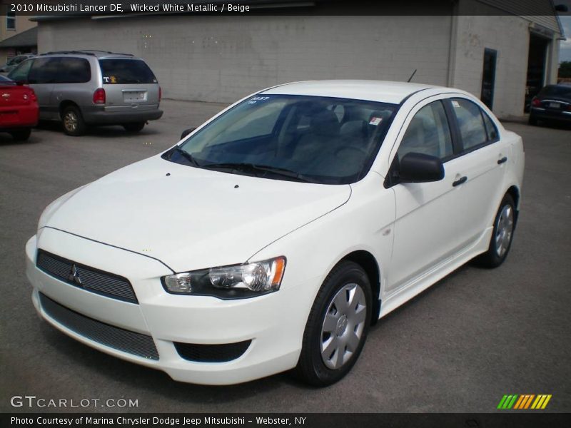 Wicked White Metallic / Beige 2010 Mitsubishi Lancer DE