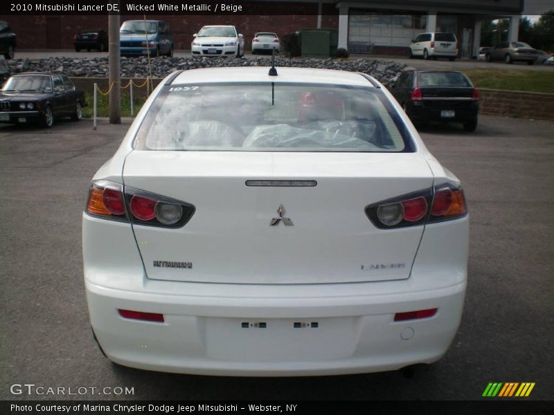 Wicked White Metallic / Beige 2010 Mitsubishi Lancer DE