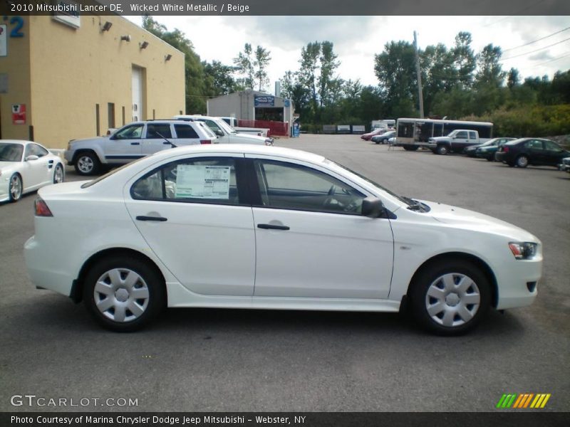 Wicked White Metallic / Beige 2010 Mitsubishi Lancer DE