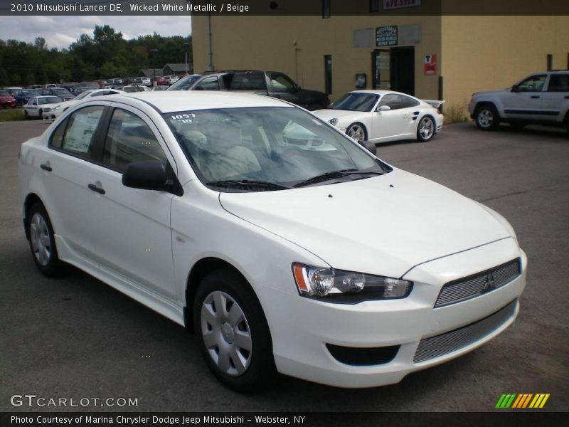 Wicked White Metallic / Beige 2010 Mitsubishi Lancer DE