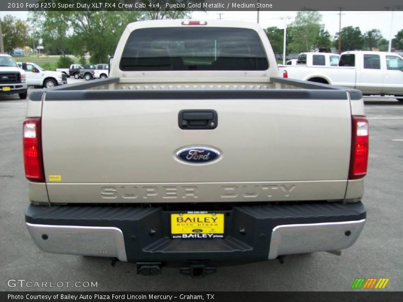 Pueblo Gold Metallic / Medium Stone 2010 Ford F250 Super Duty XLT FX4 Crew Cab 4x4