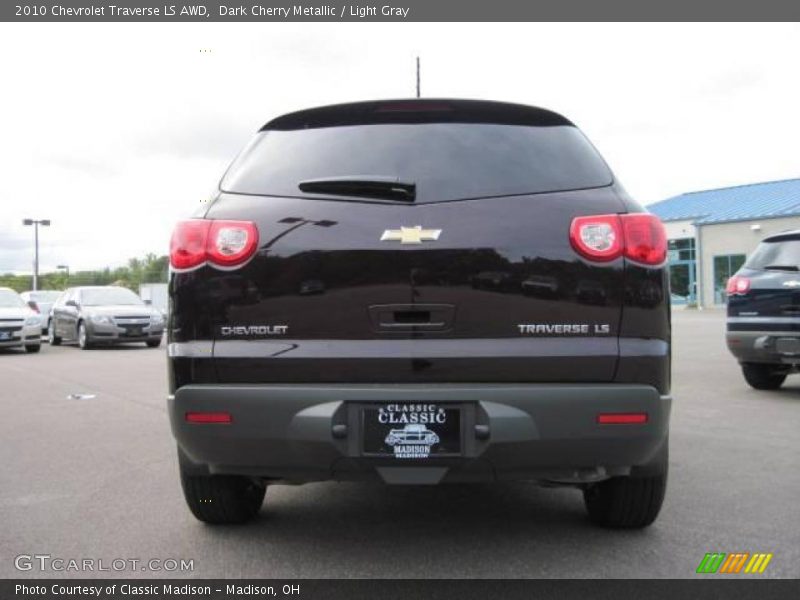 Dark Cherry Metallic / Light Gray 2010 Chevrolet Traverse LS AWD