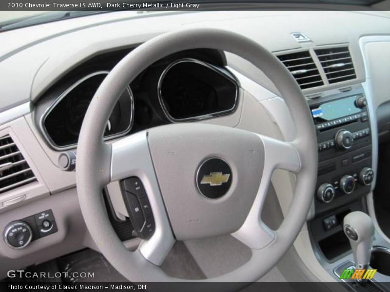 Dark Cherry Metallic / Light Gray 2010 Chevrolet Traverse LS AWD