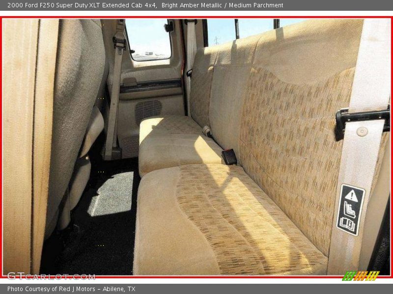 Bright Amber Metallic / Medium Parchment 2000 Ford F250 Super Duty XLT Extended Cab 4x4