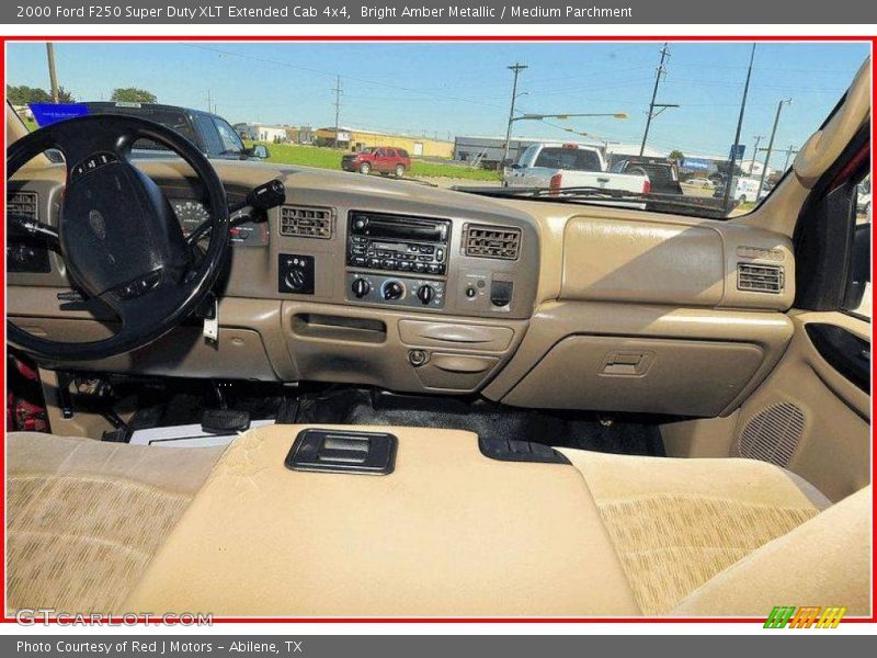 Bright Amber Metallic / Medium Parchment 2000 Ford F250 Super Duty XLT Extended Cab 4x4