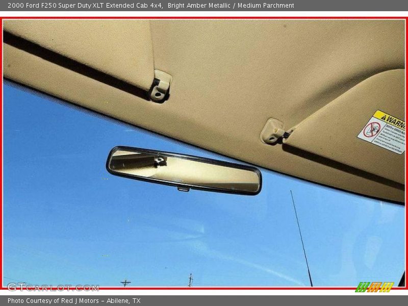 Bright Amber Metallic / Medium Parchment 2000 Ford F250 Super Duty XLT Extended Cab 4x4