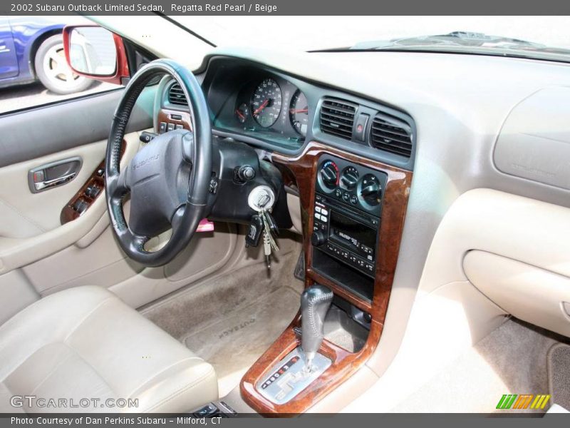 Regatta Red Pearl / Beige 2002 Subaru Outback Limited Sedan