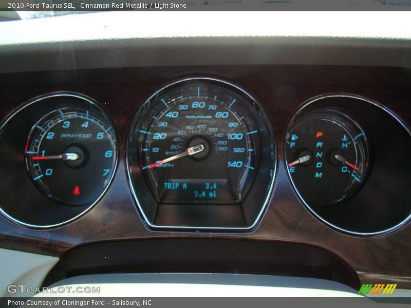 Cinnamon Red Metallic / Light Stone 2010 Ford Taurus SEL