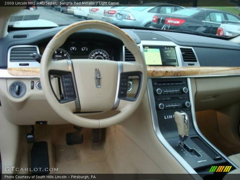 Sangria Red Metallic / Light Camel 2009 Lincoln MKS AWD Sedan