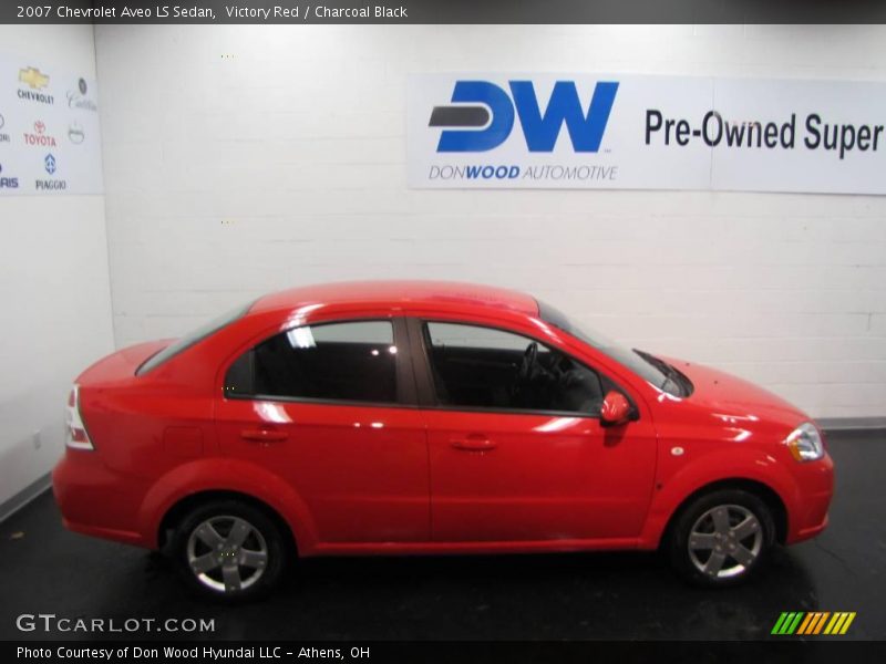 Victory Red / Charcoal Black 2007 Chevrolet Aveo LS Sedan