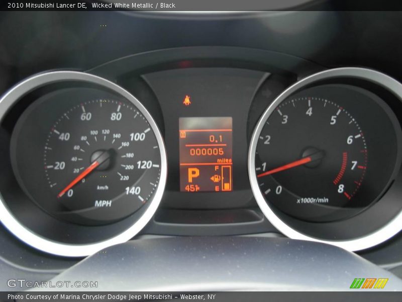 Wicked White Metallic / Black 2010 Mitsubishi Lancer DE