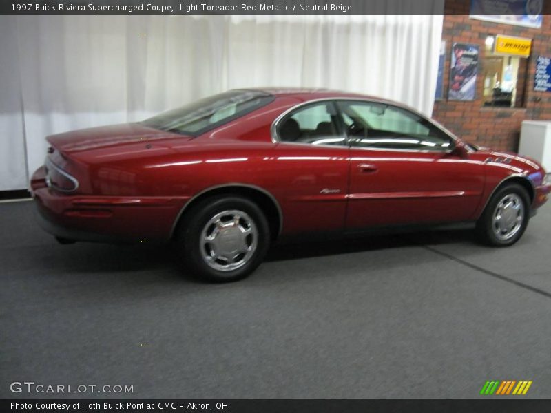 Light Toreador Red Metallic / Neutral Beige 1997 Buick Riviera Supercharged Coupe