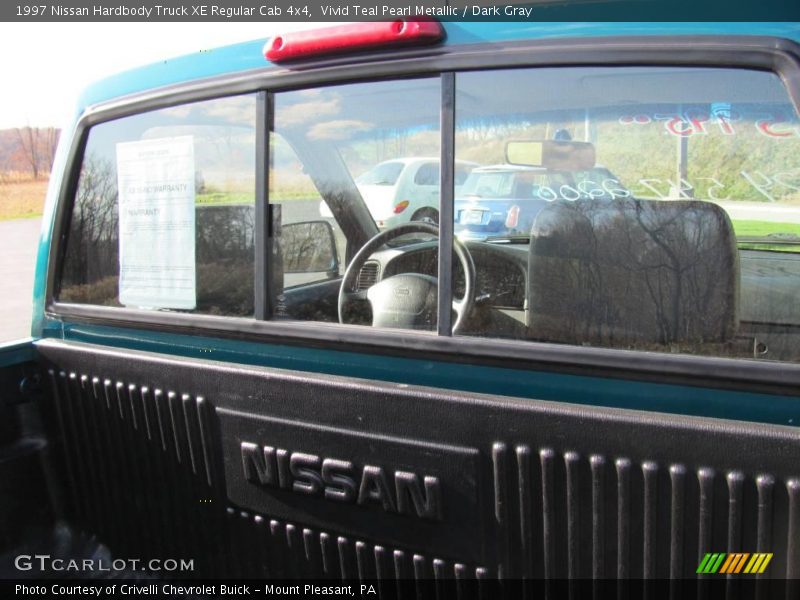 Vivid Teal Pearl Metallic / Dark Gray 1997 Nissan Hardbody Truck XE Regular Cab 4x4