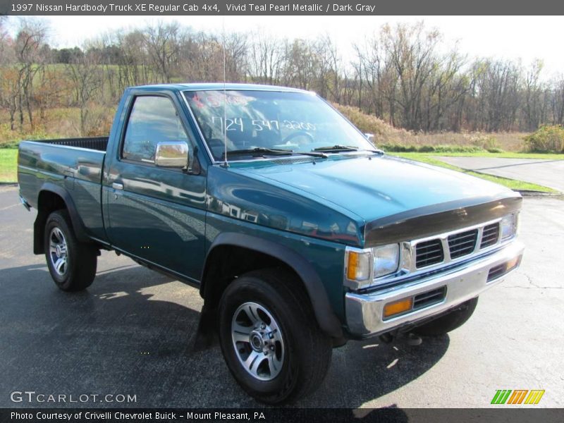 Vivid Teal Pearl Metallic / Dark Gray 1997 Nissan Hardbody Truck XE Regular Cab 4x4