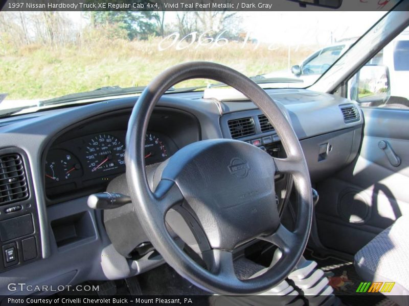 Vivid Teal Pearl Metallic / Dark Gray 1997 Nissan Hardbody Truck XE Regular Cab 4x4