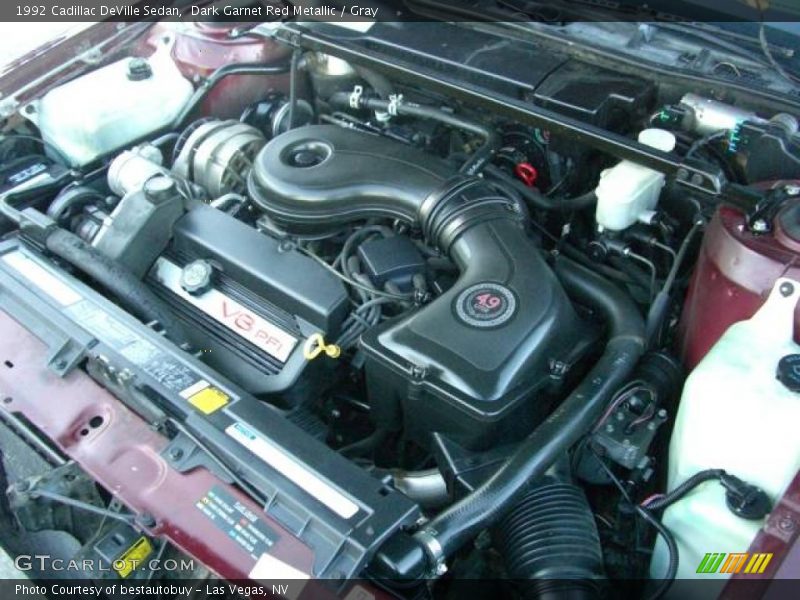 Dark Garnet Red Metallic / Gray 1992 Cadillac DeVille Sedan