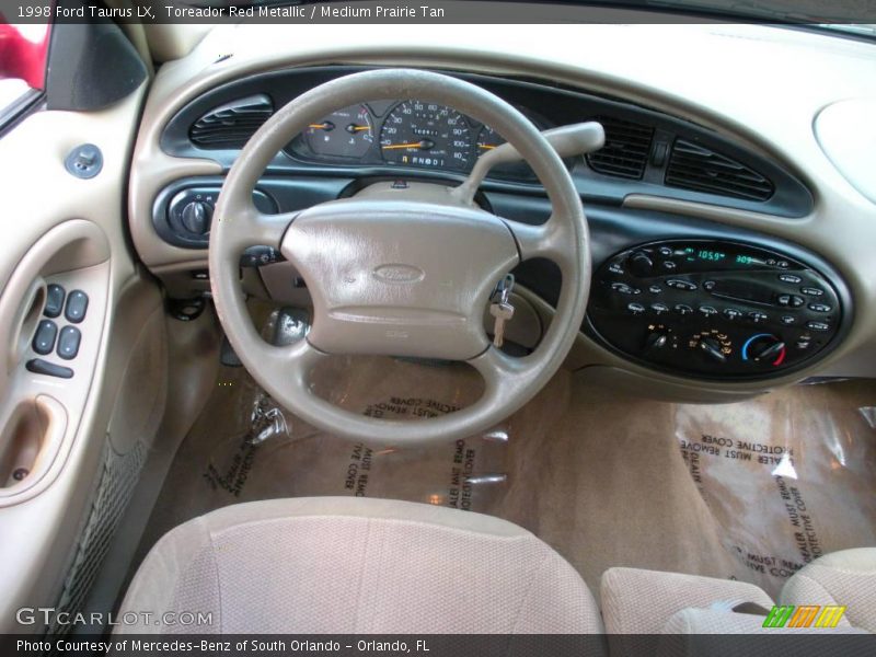 Toreador Red Metallic / Medium Prairie Tan 1998 Ford Taurus LX