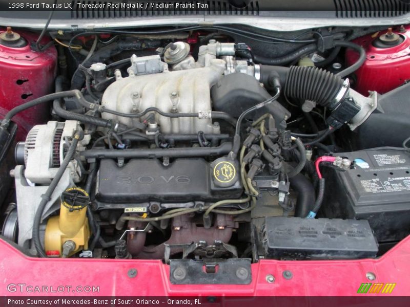 Toreador Red Metallic / Medium Prairie Tan 1998 Ford Taurus LX