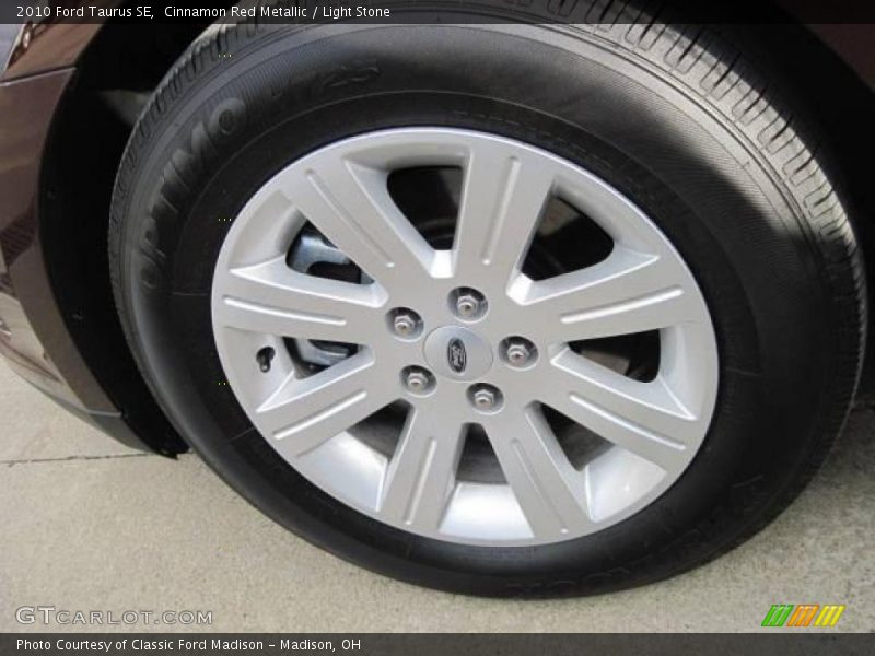 Cinnamon Red Metallic / Light Stone 2010 Ford Taurus SE