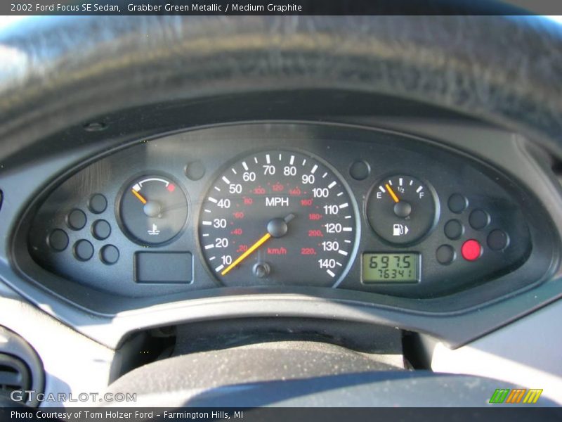 Grabber Green Metallic / Medium Graphite 2002 Ford Focus SE Sedan