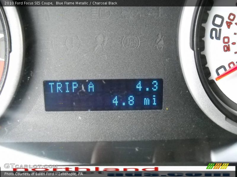 Blue Flame Metallic / Charcoal Black 2010 Ford Focus SES Coupe