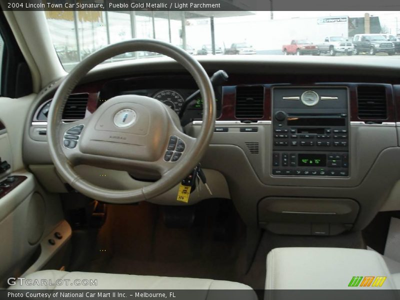 Pueblo Gold Metallic / Light Parchment 2004 Lincoln Town Car Signature