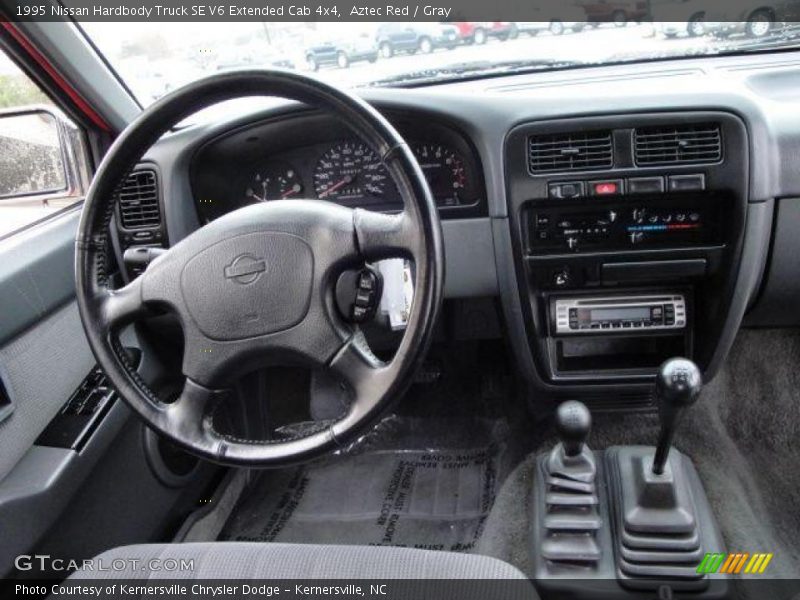 Aztec Red / Gray 1995 Nissan Hardbody Truck SE V6 Extended Cab 4x4