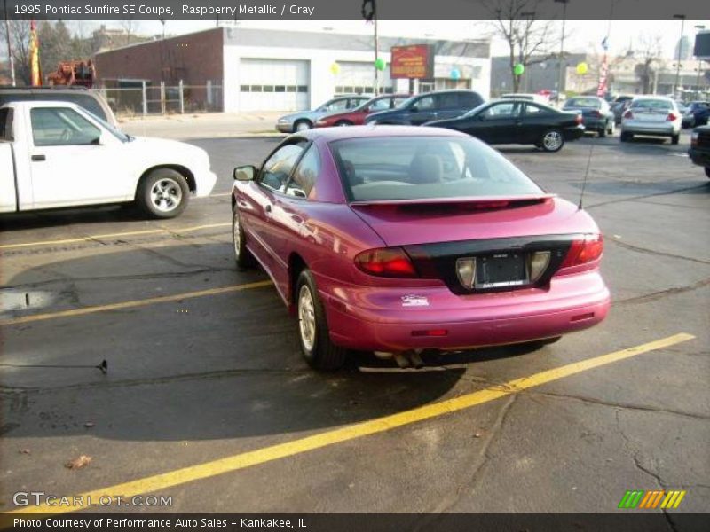 Raspberry Metallic / Gray 1995 Pontiac Sunfire SE Coupe