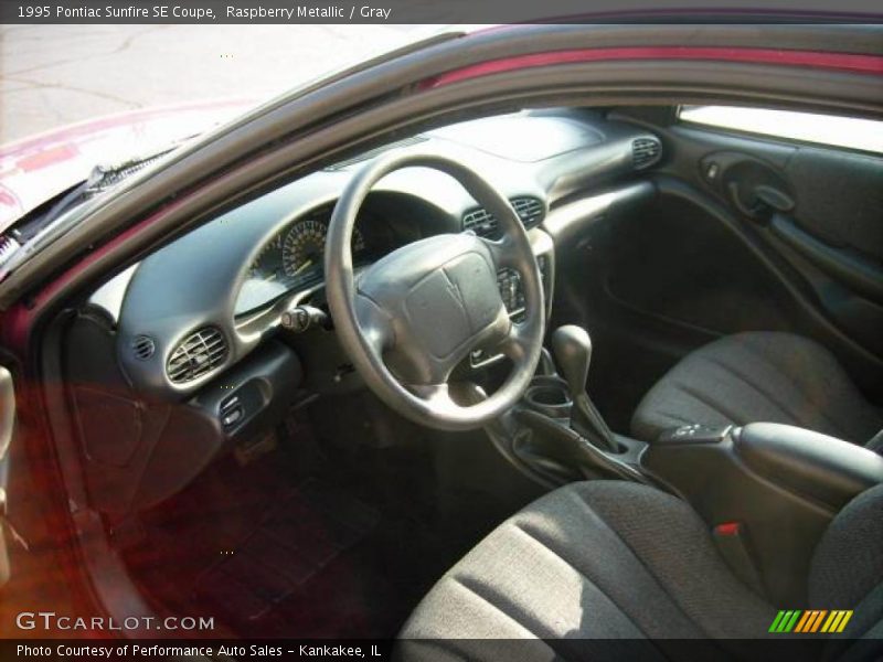 Raspberry Metallic / Gray 1995 Pontiac Sunfire SE Coupe