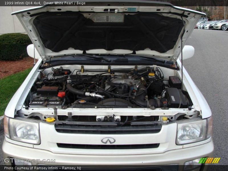 Dover White Pearl / Beige 1999 Infiniti QX4 4x4
