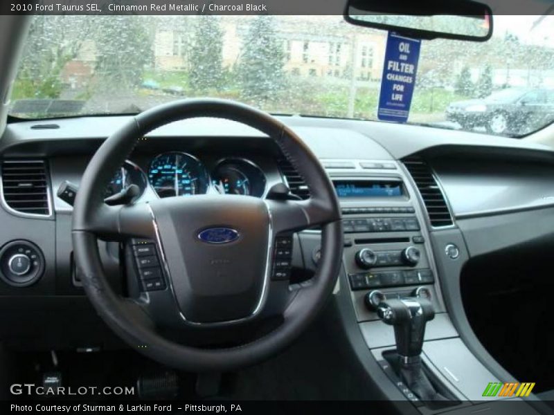 Cinnamon Red Metallic / Charcoal Black 2010 Ford Taurus SEL