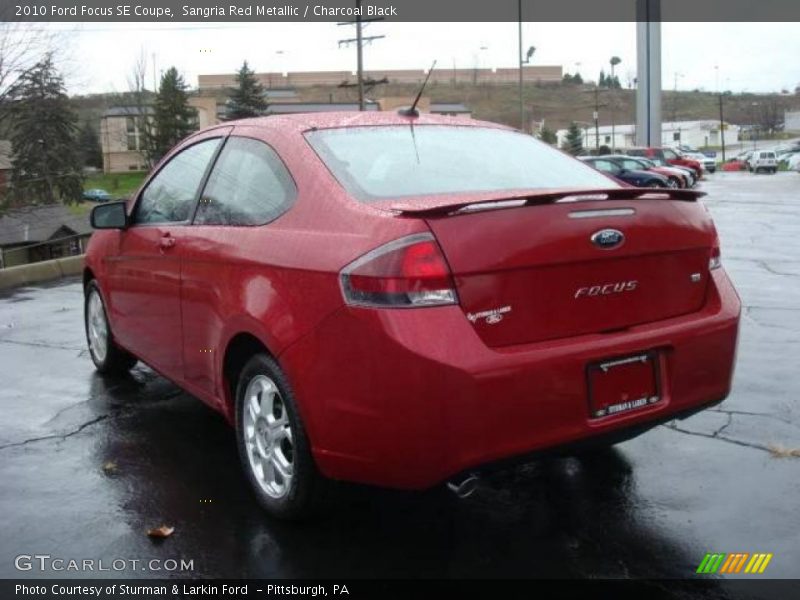 Sangria Red Metallic / Charcoal Black 2010 Ford Focus SE Coupe