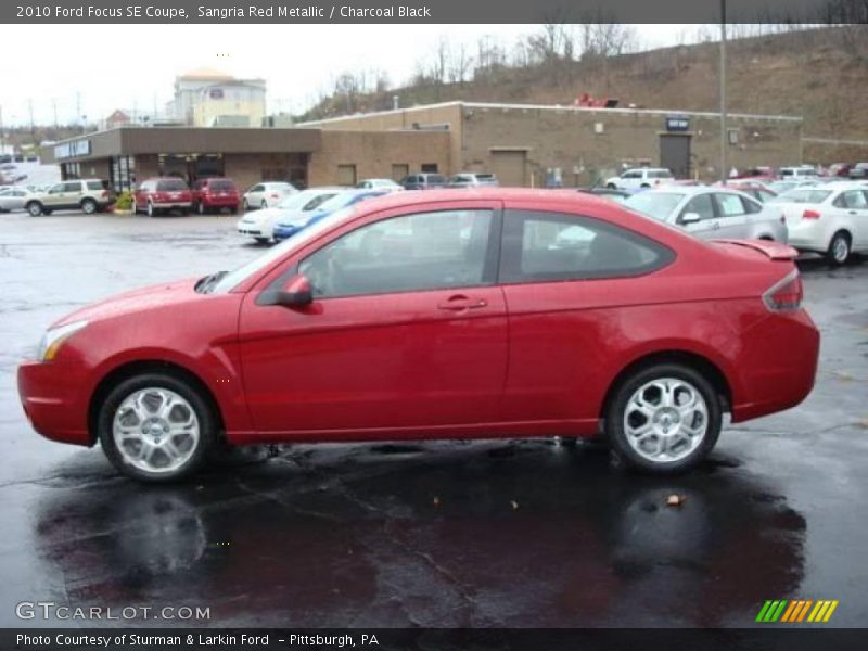 Sangria Red Metallic / Charcoal Black 2010 Ford Focus SE Coupe