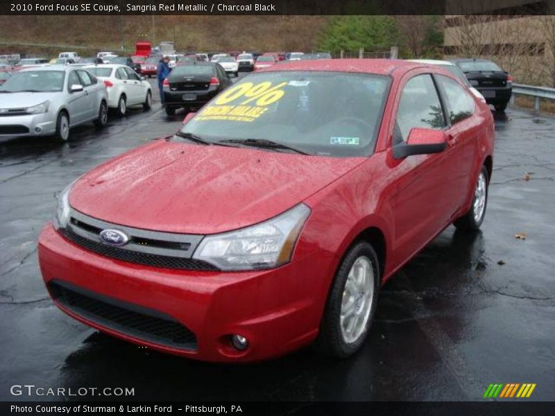 Sangria Red Metallic / Charcoal Black 2010 Ford Focus SE Coupe