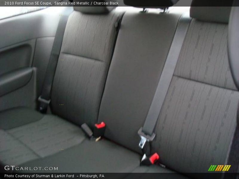 Sangria Red Metallic / Charcoal Black 2010 Ford Focus SE Coupe