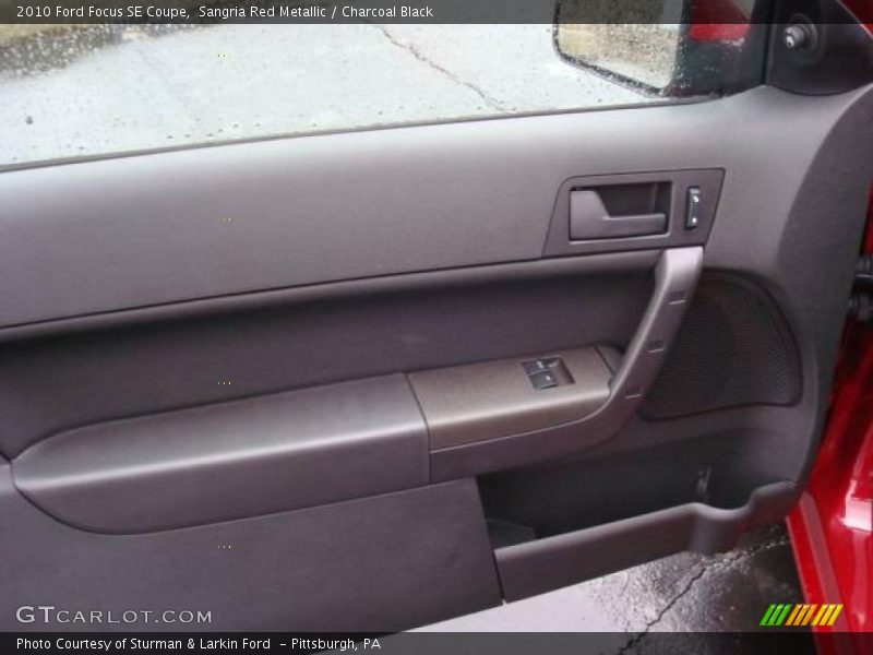 Sangria Red Metallic / Charcoal Black 2010 Ford Focus SE Coupe