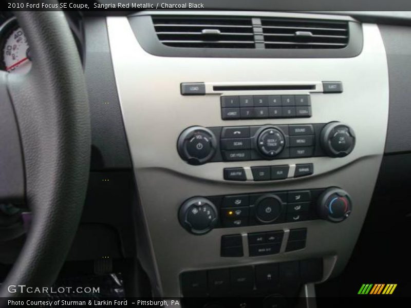 Sangria Red Metallic / Charcoal Black 2010 Ford Focus SE Coupe