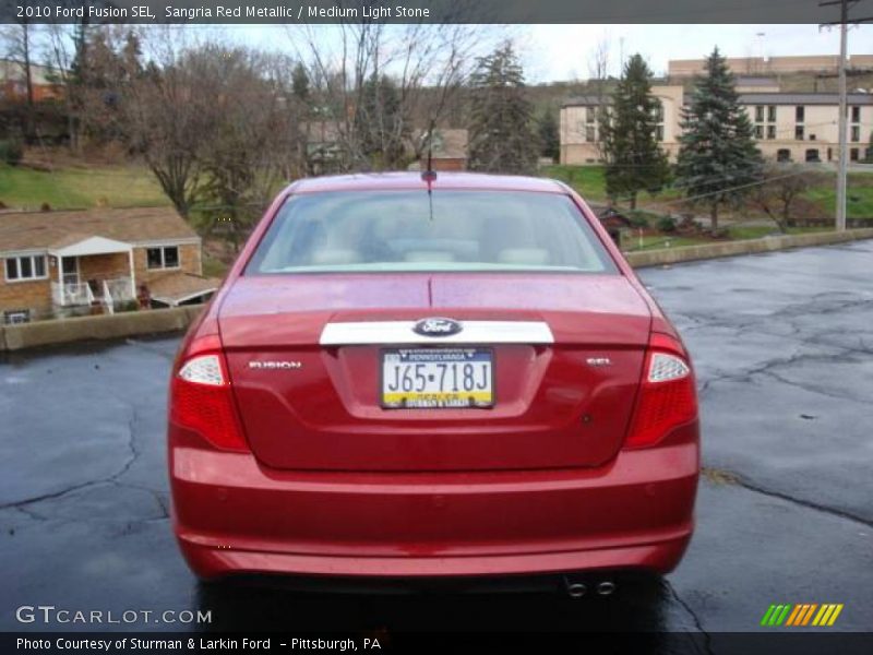 Sangria Red Metallic / Medium Light Stone 2010 Ford Fusion SEL