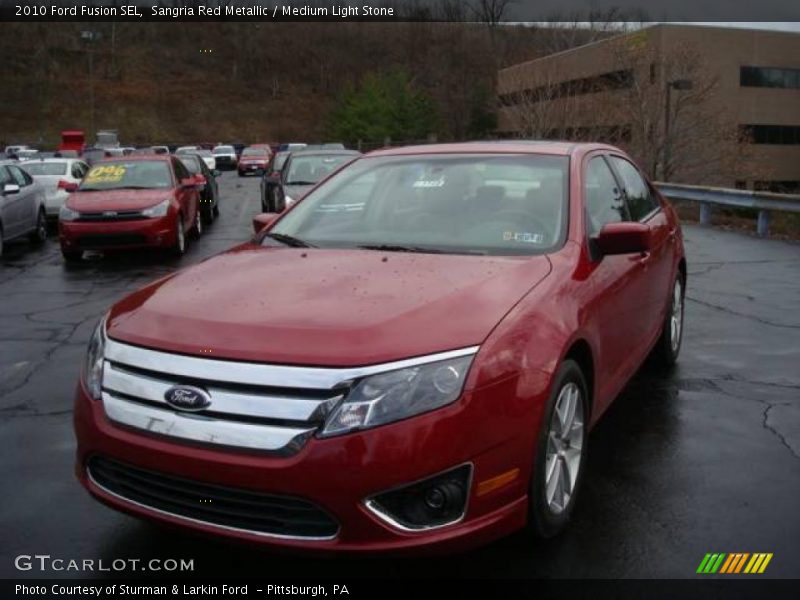 Sangria Red Metallic / Medium Light Stone 2010 Ford Fusion SEL